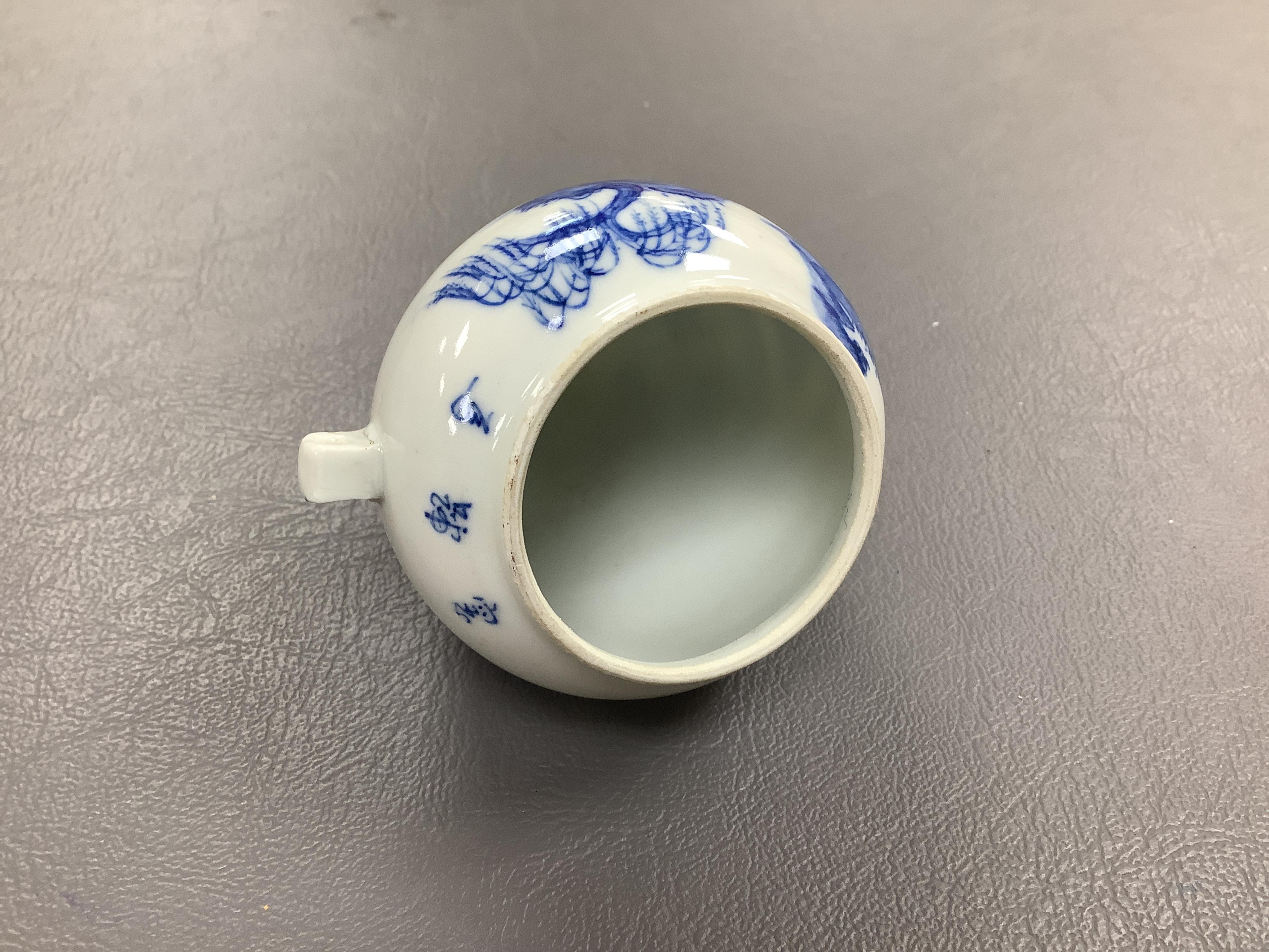 A Chinese enamelled white glass snuff bottle, a blue and white bird feeder and a famille rose vase, the first 9cm